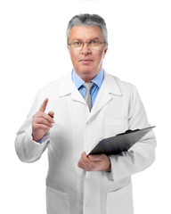 A handsome doctor with clipboard, isolated on white