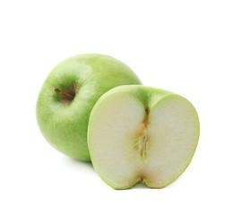 Green apple next to a slice isolated