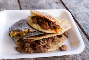 Traditional Mexican Gorditas stuffed with cheese, veggies and meats, served in the town of Creel, Mexico