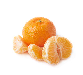 Whole tangerine next to peeled slices