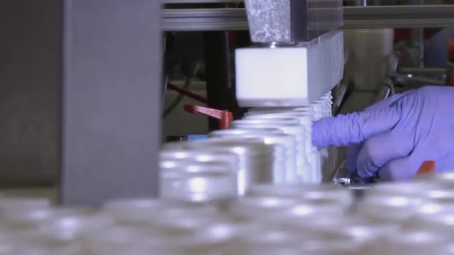 Closeup shot of plastic bottles being filled.
