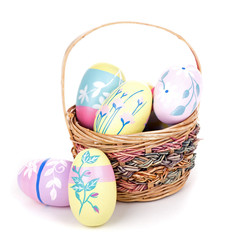 Colorful Easter Eggs and Basket on a White Background