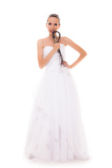 bride white gown holds black leather flogging whip