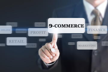 Fototapeta premium Businessman pressing E-COMMERCE concept button. Can be used in advertising.