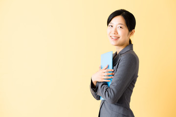 asian businesswoman isolated on yellow background