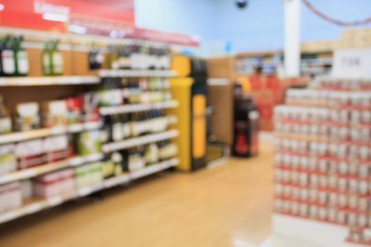 wine shelves in supermarket blurred background