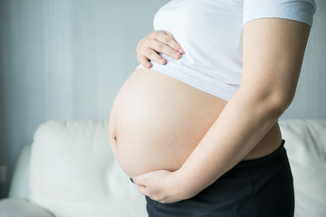 Pregnant woman with ultrasound scan picture
