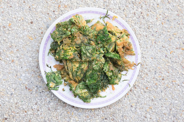 Fried acacia pennata omelet or cha-om egg