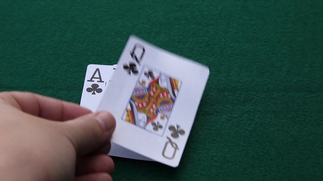 This is a video of a person laying down 5 playing cards making a straight flush.