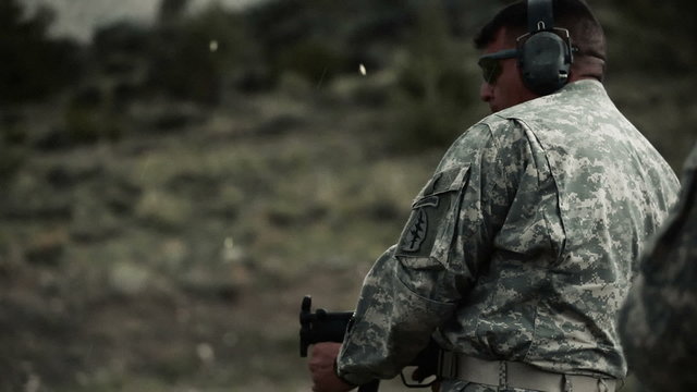Soldier shoots an MP5 at waist level