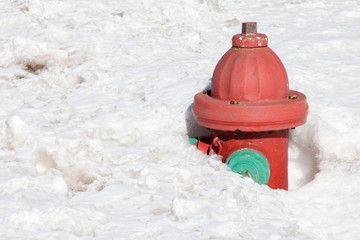 Fire hydrant completely covered in deep snow