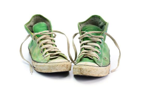dirty sneakers isolated on a white background