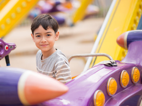 Little boy in amusement park