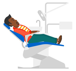 Patient in dental chair.