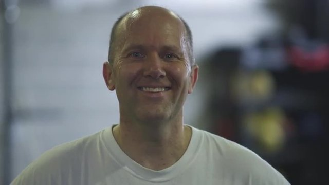 Static shot of a laughing middle-aged man