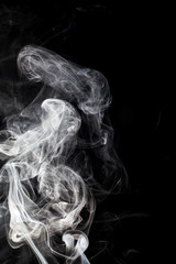 White smoke on black background.