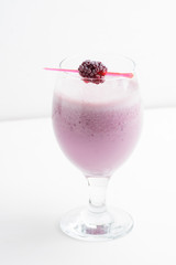 Blackberry smoothie on the wooden background