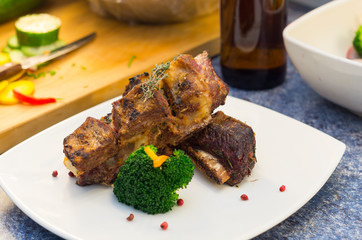 Delicious rib steak and vegetables placed on white plate, elegant presentation
