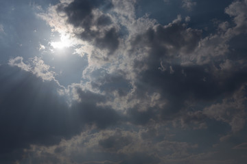 sunbeam through the clouds of sunlight in blue sky background