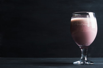 Blackberry smoothie on the wooden background