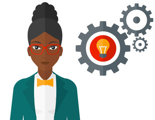 Woman with bulb and gears.