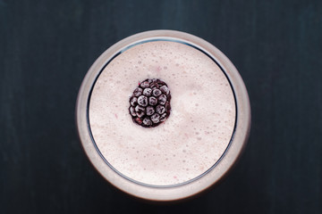 Blackberry smoothie on the wooden background
