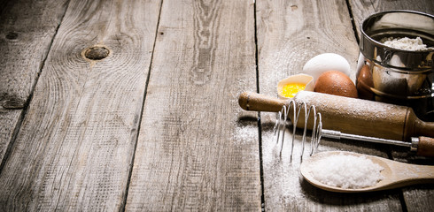 Preparation of the dough. Ingredients for the dough - Eggs and flour with a rolling pin.