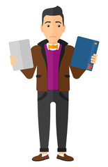 Man choosing between book and tablet computer.