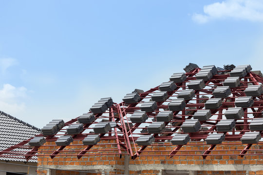 black tile roof on residential building construction house