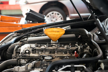 Yellow plastic funnel for pouring oil