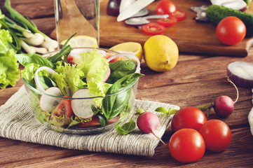 fresh salad with a glass of water