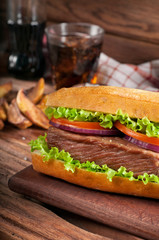 meat sandwich a on wooden background