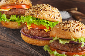 closeup burger on wooden background with copy space