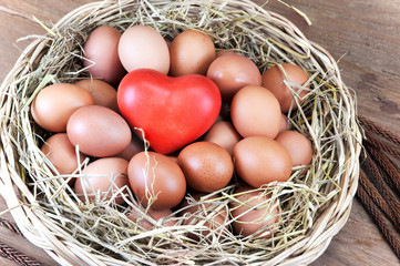 eggs and red heart in a basket
