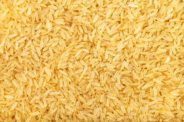 yellow parboiled long-grain Indica rice - obrazy, fototapety, plakaty