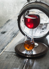Two wineglasses and old barrel