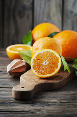 Fresh sweet oranges on the wooden table