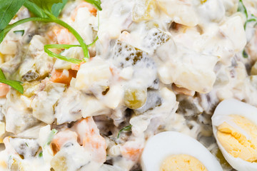 russian salad close up with parsley and eggs