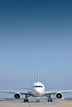 Fototapeta Passenger plane on runway