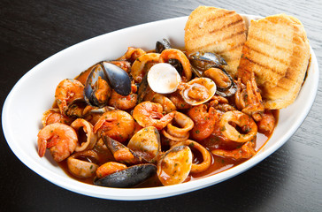 fresh seafood soup with roasted bread