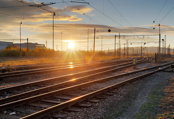 Fototapeta na wymiar Railway, railroad lines at sunset