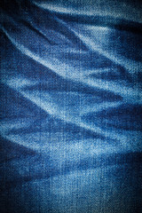 Vintage Blue torn denim jeans texture.