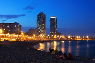 Fototapeta na wymiar Somorrostro Beach in summer twilight. Barcelona