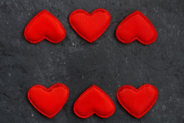black stone background with frames of red hearts