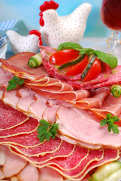 platter of cured meat,ham and salami on eater table
