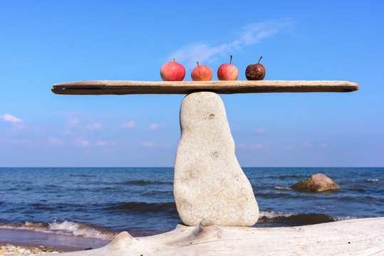 Apples in balance on stone