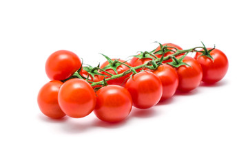 tomatoes with green leaves isolated on white background