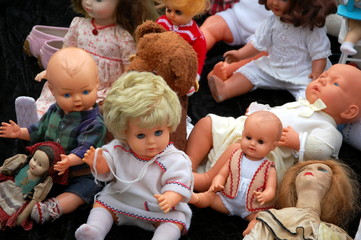 Flea market in Bruges, Belgium. Sale of old dolls