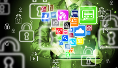 Business man using tablet PC with social media icon set