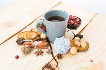 Tea cups with teapot on old wooden table